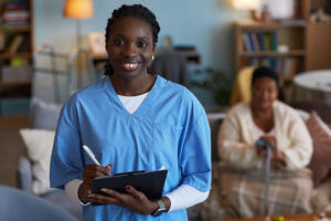 NHTD Waiver Program caregiver assisting a senior adult at home with personalized care services