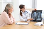 Senior with COPD receiving home care support while using oxygen therapy in a comfortable home setting