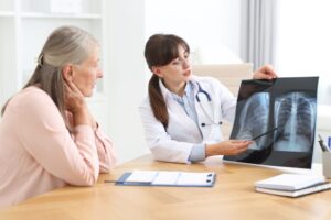 Senior with COPD receiving home care support while using oxygen therapy in a comfortable home setting