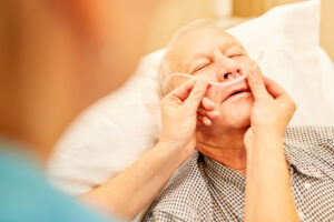 Elderly person receiving breathing support and care for chronic obstructive pulmonary disease at home