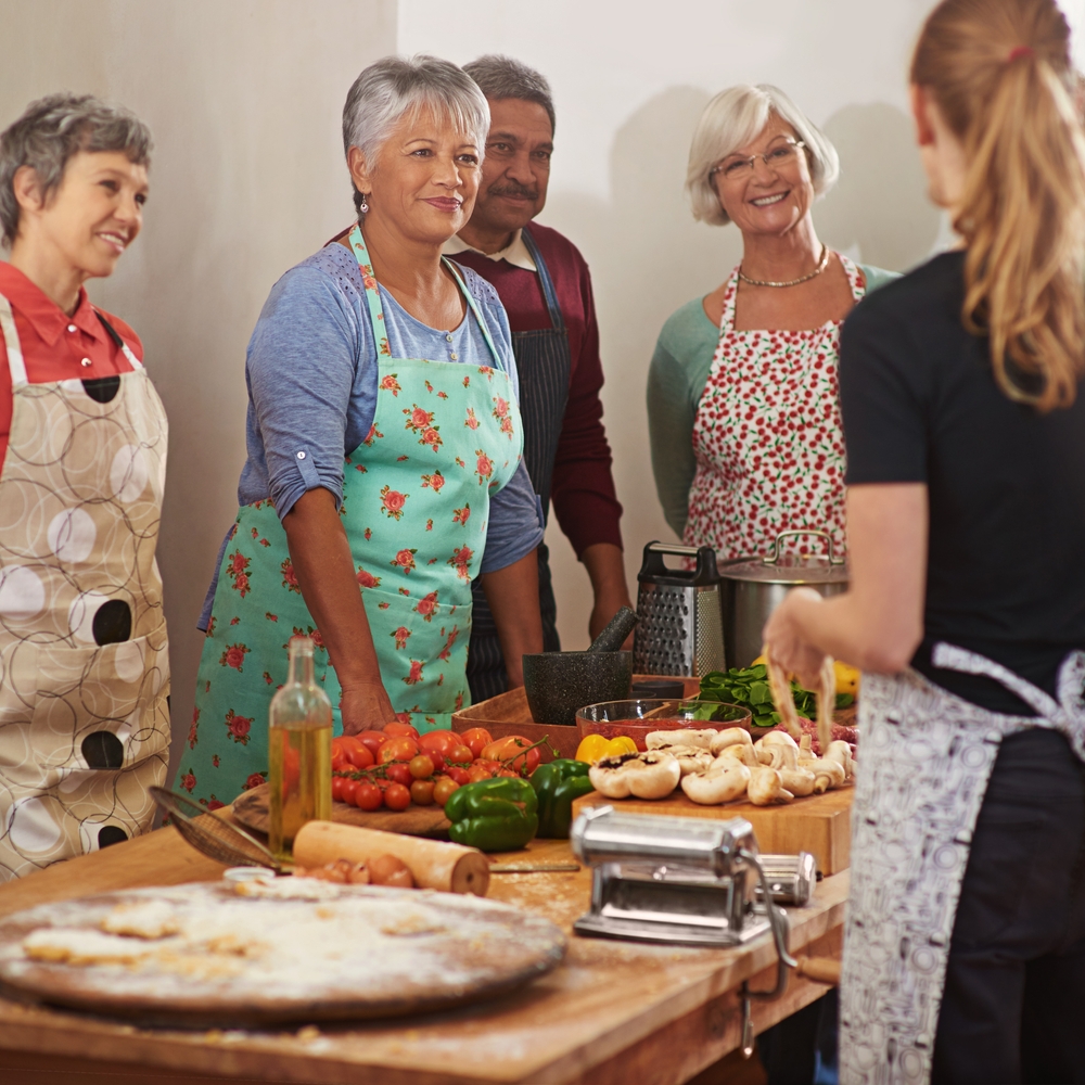 Seniors participating in fun group activities that promote happiness, movement, and social connection