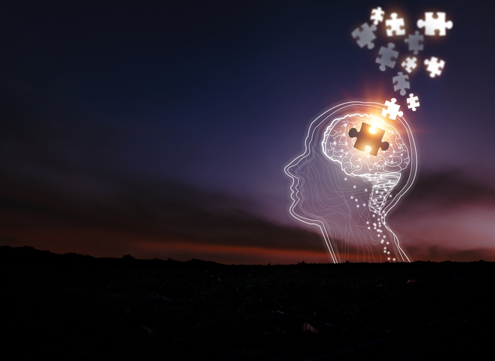 Early-onset Alzheimer’s awareness concept showing a younger adult holding their head in concern while reviewing memory notes and medical information.