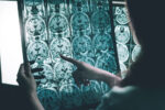 Senior patient undergoing cognitive evaluation with a healthcare professional during an Alzheimer’s diagnosis assessment.