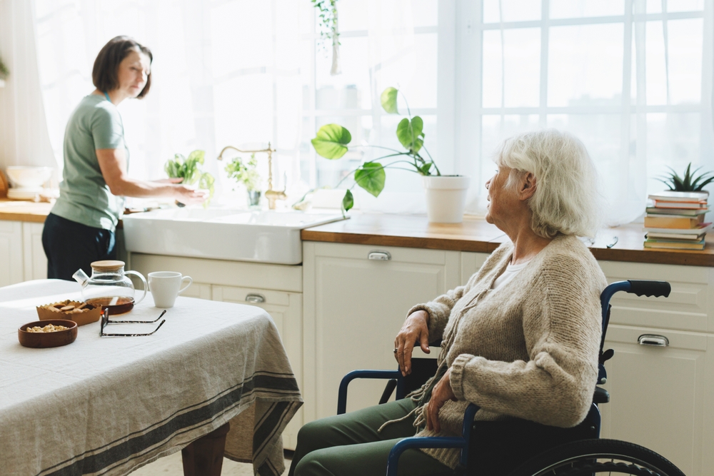 TBI survivor practicing daily living activities with occupational therapist at home
