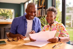 Speech therapist providing in-home speech therapy to a traumatic brain injury survivor practicing communication exercises